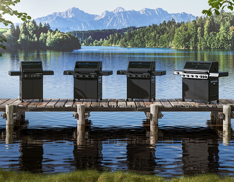 ALLFLAME grills All four Allflame Grill models stand on a footbridge in front of a mountain backdrop