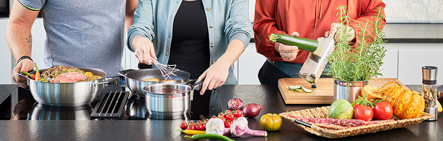 Multifunction grater Slicing a courgette with the Multifunction Grater and cooking on the cooker in the Silence Pro Serving Pan and Saucepan with the Gourmet Whisk